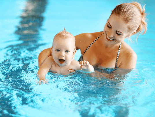 mother and baby in pool